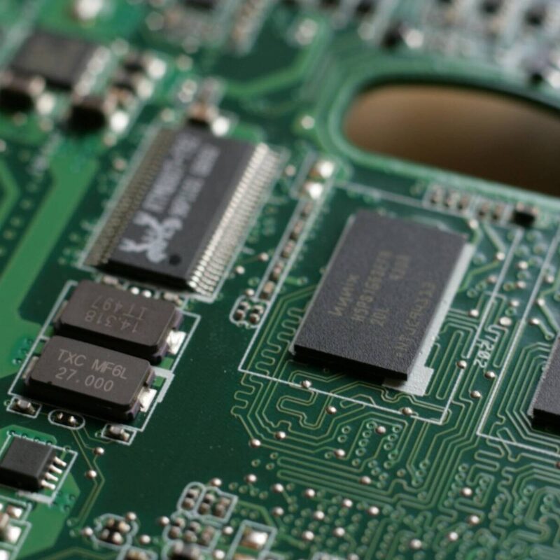 a close up of a circuit board with many chip pieces